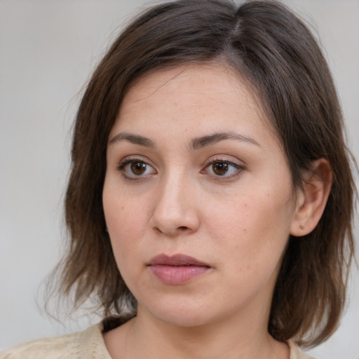 Neutral white young-adult female with medium  brown hair and brown eyes