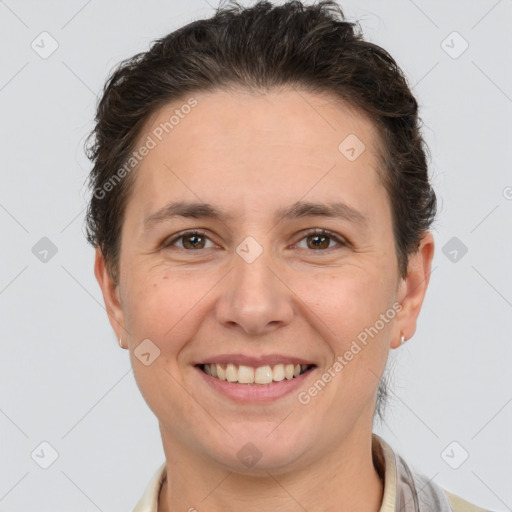 Joyful white adult female with short  brown hair and brown eyes