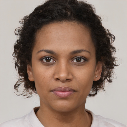 Neutral black young-adult female with short  brown hair and brown eyes