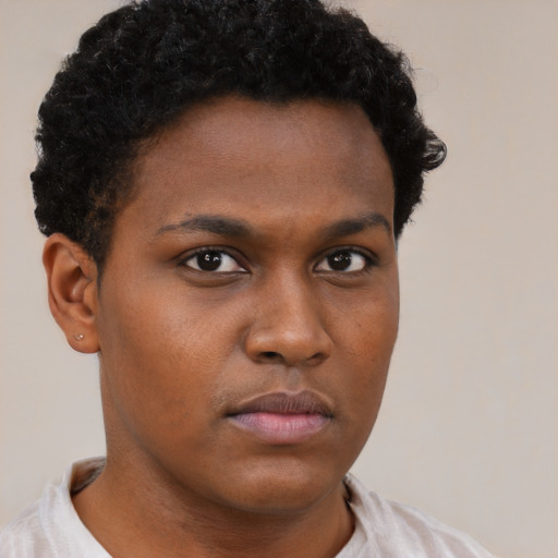 Neutral latino young-adult male with short  brown hair and brown eyes