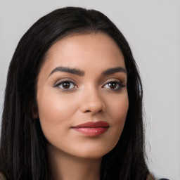 Joyful latino young-adult female with long  black hair and brown eyes