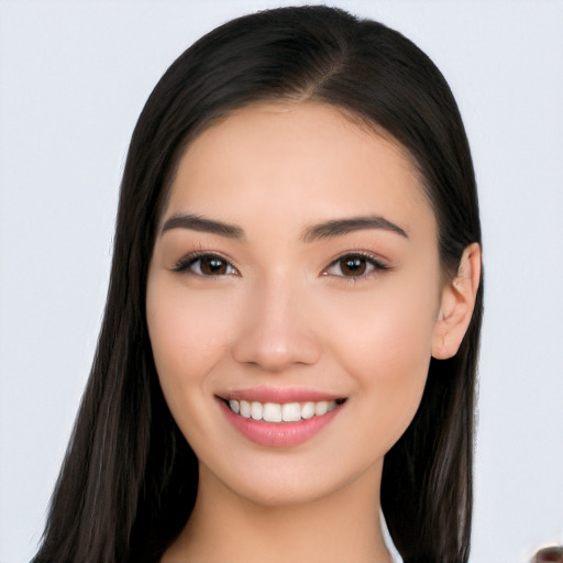 Joyful white young-adult female with long  black hair and brown eyes