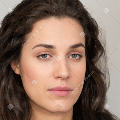 Neutral white young-adult female with long  brown hair and brown eyes