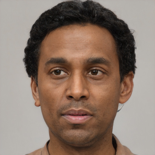 Neutral black young-adult male with short  black hair and brown eyes