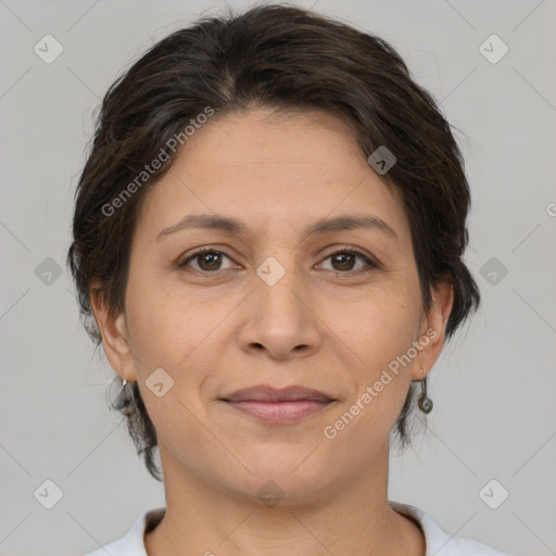 Joyful white adult female with medium  brown hair and brown eyes