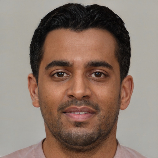 Neutral black young-adult male with short  black hair and brown eyes