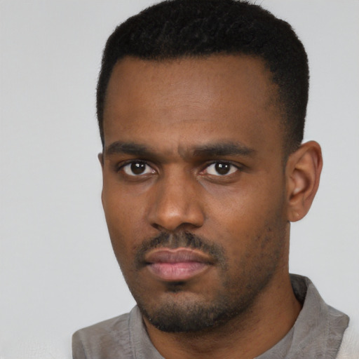 Neutral black young-adult male with short  black hair and brown eyes