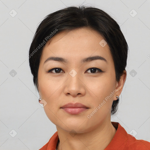 Joyful asian young-adult female with medium  black hair and brown eyes