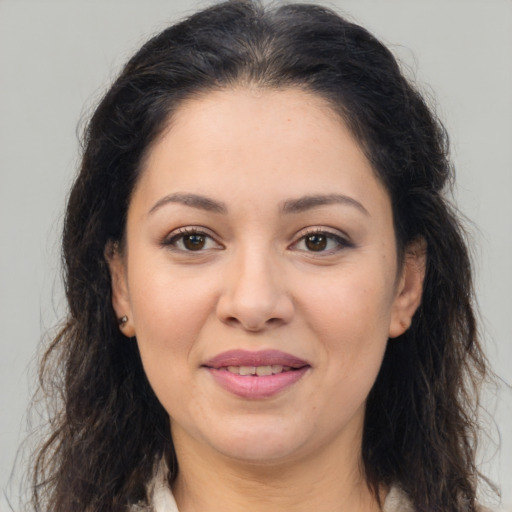 Joyful white young-adult female with long  brown hair and brown eyes