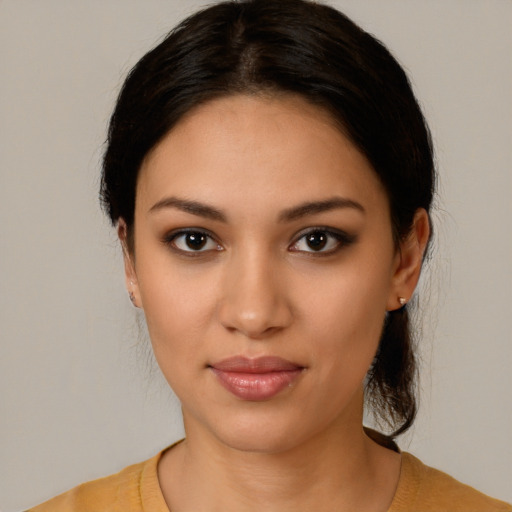 Joyful latino young-adult female with medium  black hair and brown eyes