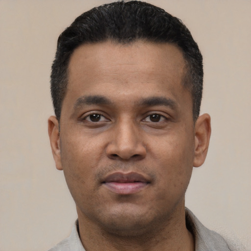 Neutral latino young-adult male with short  black hair and brown eyes