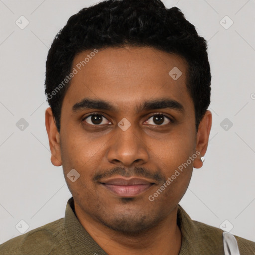 Joyful black young-adult male with short  black hair and brown eyes