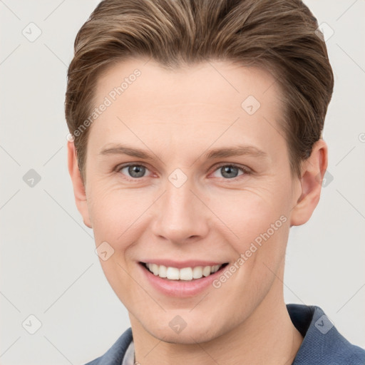 Joyful white young-adult female with short  brown hair and grey eyes