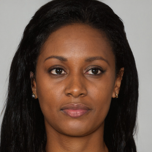 Joyful asian young-adult female with long  black hair and brown eyes