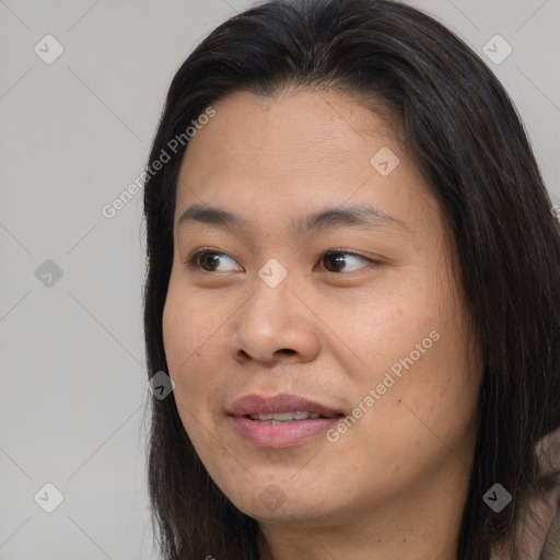 Joyful asian young-adult female with long  brown hair and brown eyes