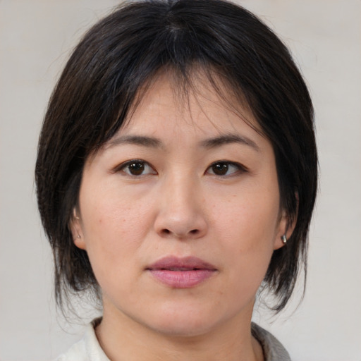 Neutral asian young-adult female with medium  brown hair and brown eyes