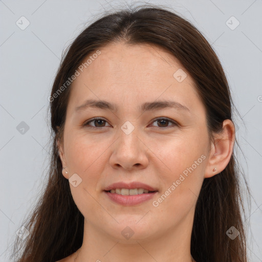 Joyful white young-adult female with long  brown hair and brown eyes