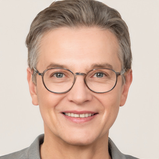 Joyful white adult male with short  brown hair and grey eyes