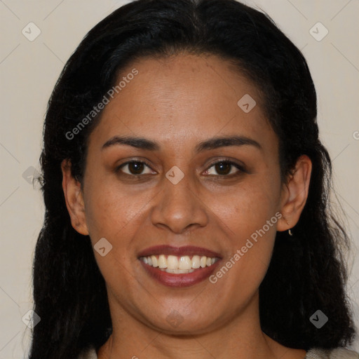 Joyful latino young-adult female with long  brown hair and brown eyes