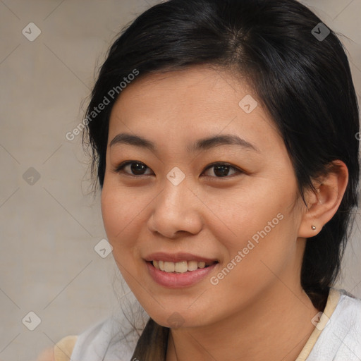 Joyful asian young-adult female with medium  brown hair and brown eyes