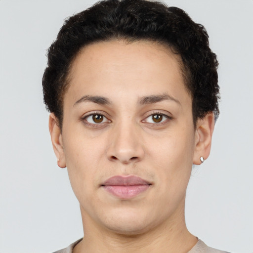 Joyful latino young-adult female with short  brown hair and brown eyes