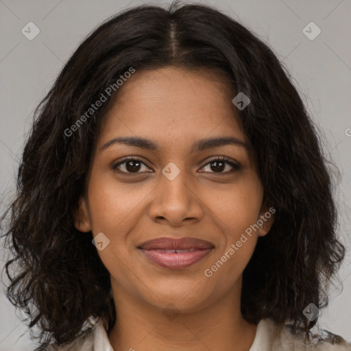 Joyful black young-adult female with medium  brown hair and brown eyes