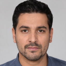 Neutral white young-adult male with short  black hair and brown eyes
