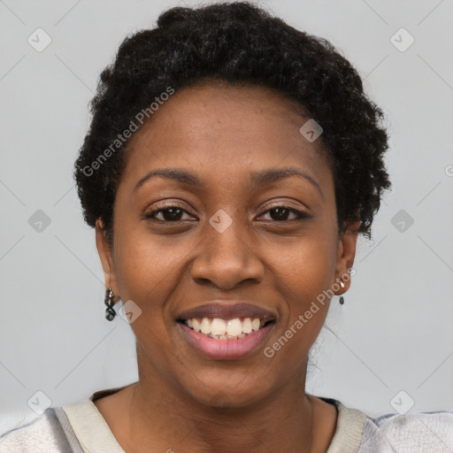 Joyful black young-adult female with short  black hair and brown eyes