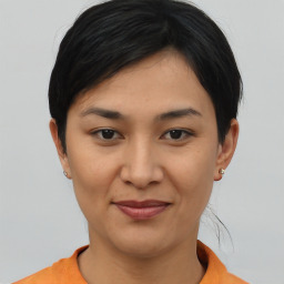 Joyful asian young-adult female with short  brown hair and brown eyes