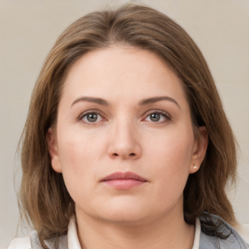 Neutral white young-adult female with medium  brown hair and grey eyes