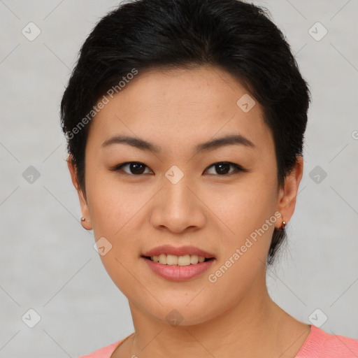 Joyful asian young-adult female with short  black hair and brown eyes