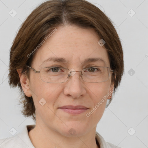 Joyful white adult female with medium  brown hair and green eyes