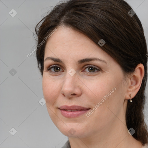 Joyful white adult female with medium  brown hair and brown eyes