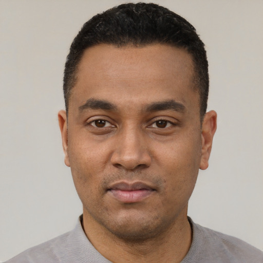 Neutral black young-adult male with short  black hair and brown eyes