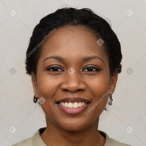 Joyful black young-adult female with medium  black hair and brown eyes