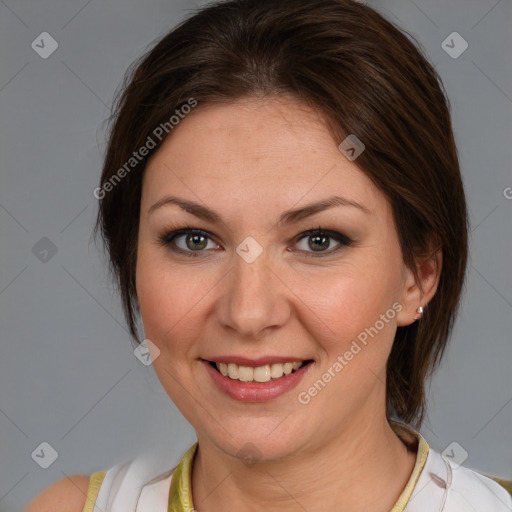 Joyful white adult female with medium  brown hair and brown eyes