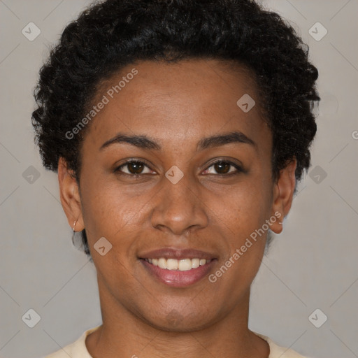 Joyful black young-adult female with short  brown hair and brown eyes