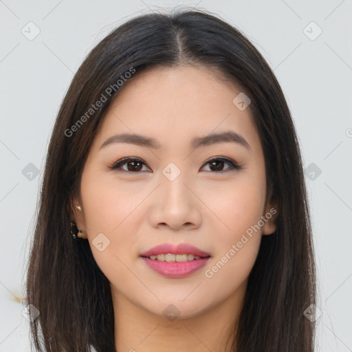 Joyful asian young-adult female with long  brown hair and brown eyes