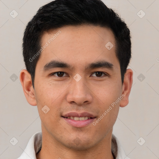 Joyful latino young-adult male with short  brown hair and brown eyes