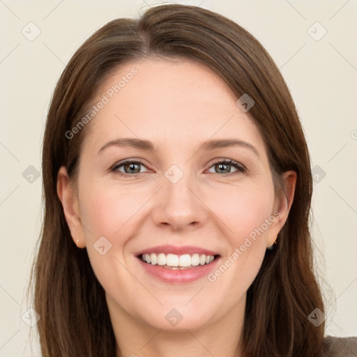 Joyful white young-adult female with long  brown hair and green eyes