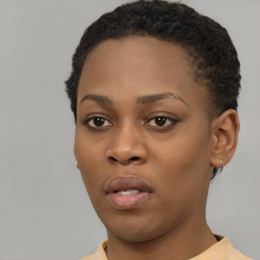 Neutral black young-adult female with short  black hair and brown eyes