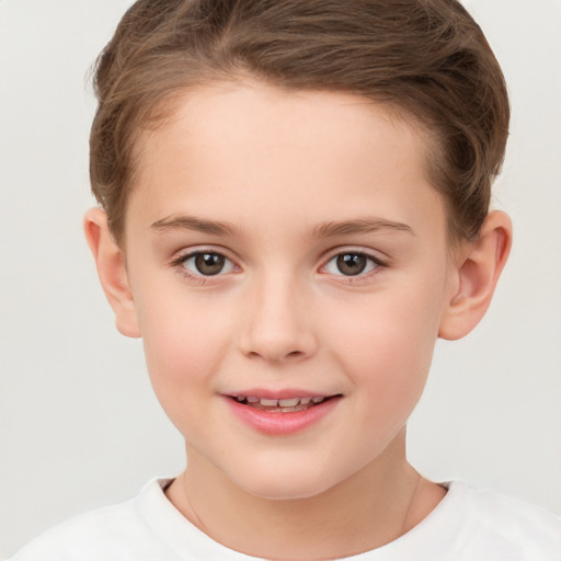 Joyful white child female with short  brown hair and brown eyes