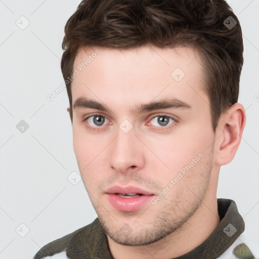 Neutral white young-adult male with short  brown hair and brown eyes