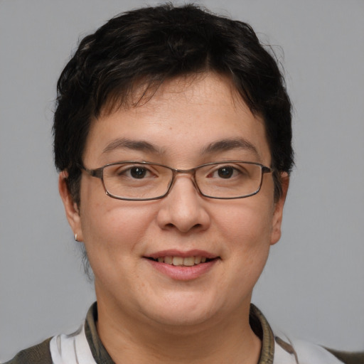 Joyful white adult female with short  brown hair and brown eyes