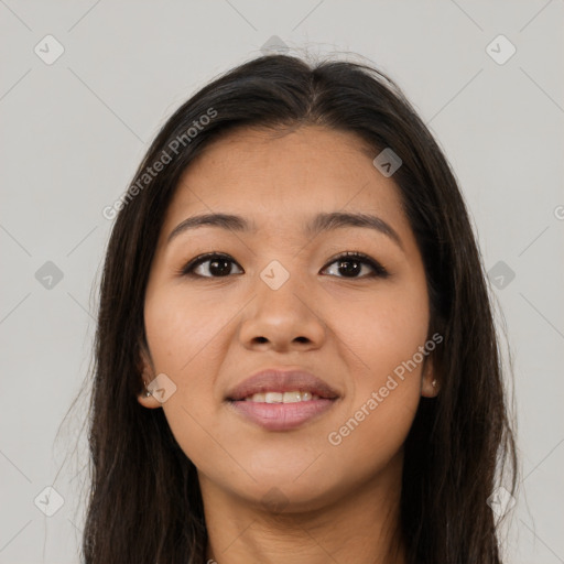 Joyful asian young-adult female with long  brown hair and brown eyes