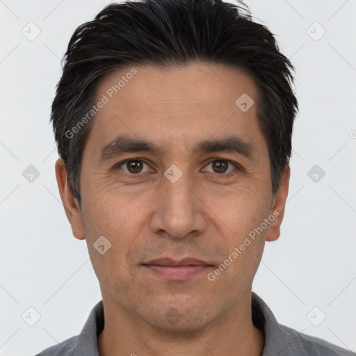 Joyful white adult male with short  black hair and brown eyes