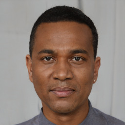 Neutral black young-adult male with short  black hair and brown eyes