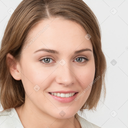 Joyful white young-adult female with medium  brown hair and blue eyes