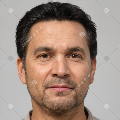 Joyful white adult male with short  brown hair and brown eyes