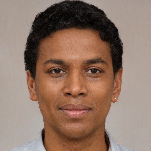 Neutral black young-adult male with short  black hair and brown eyes